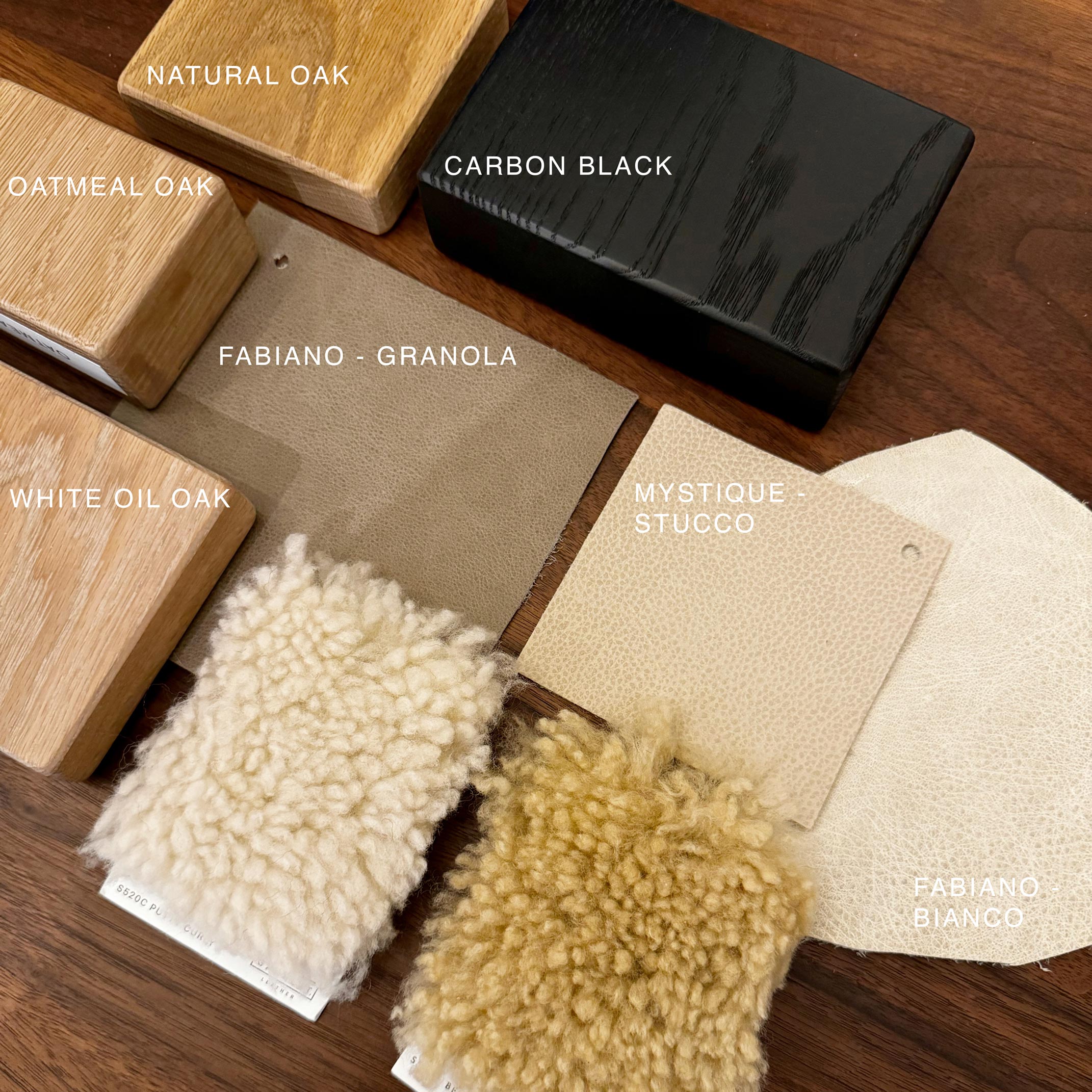 Color swatches of wood and fabric on a wooden surface with labels.