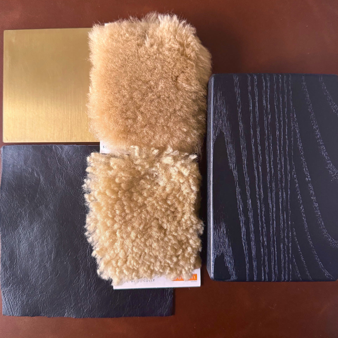Sheepskin and black oak and brass and black leather