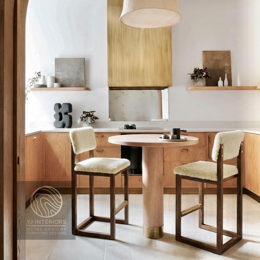 Modern kitchen with wooden dining table and chairs, featuring YJ Interiors branding.
