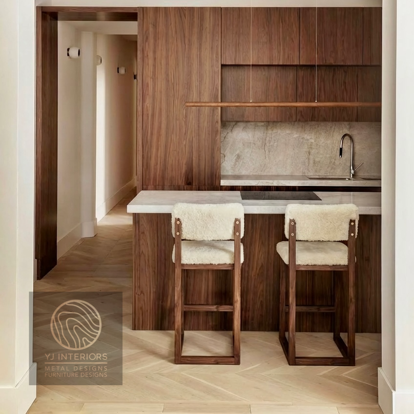 Modern kitchen with wooden cabinets, bar stools, and a countertop.