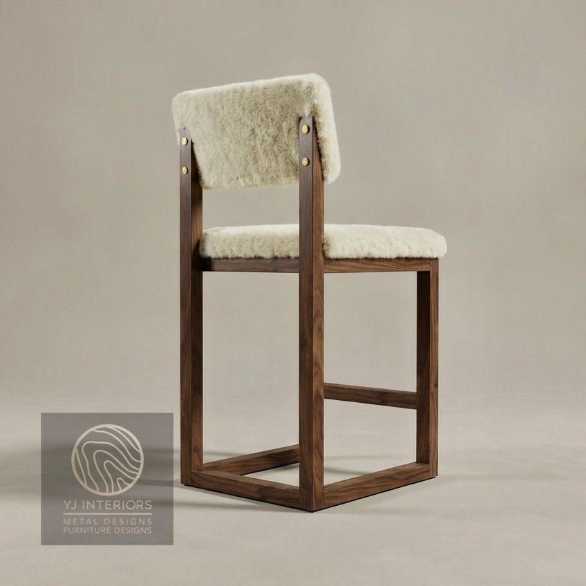 Wooden bar stool with sheepskin seat and backrest on a neutral background, branded 'YJ Interiors'.