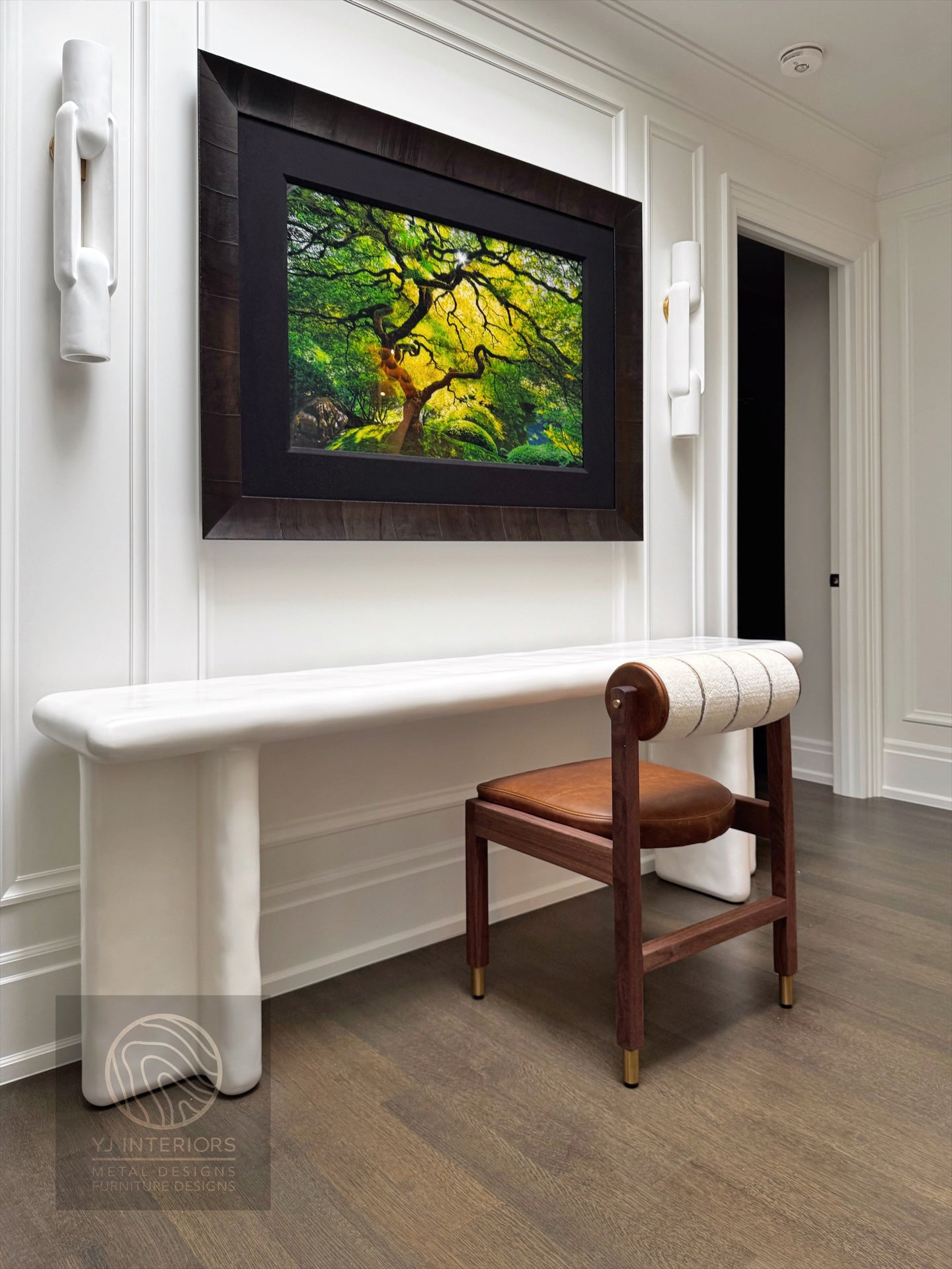 Foyer with a bench, Rody bolster chair, and wall art in a home interior.