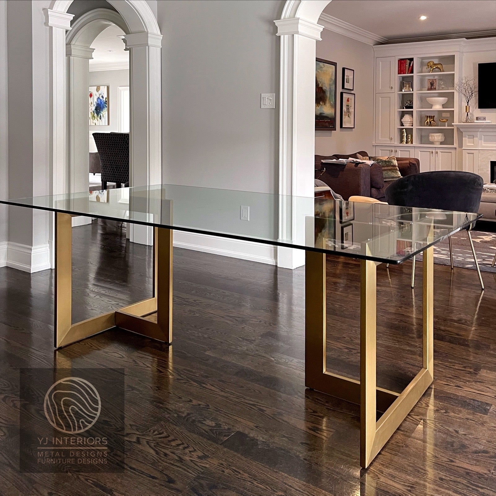 Modern trio table with clear tempered glass top and brass finish metal base.