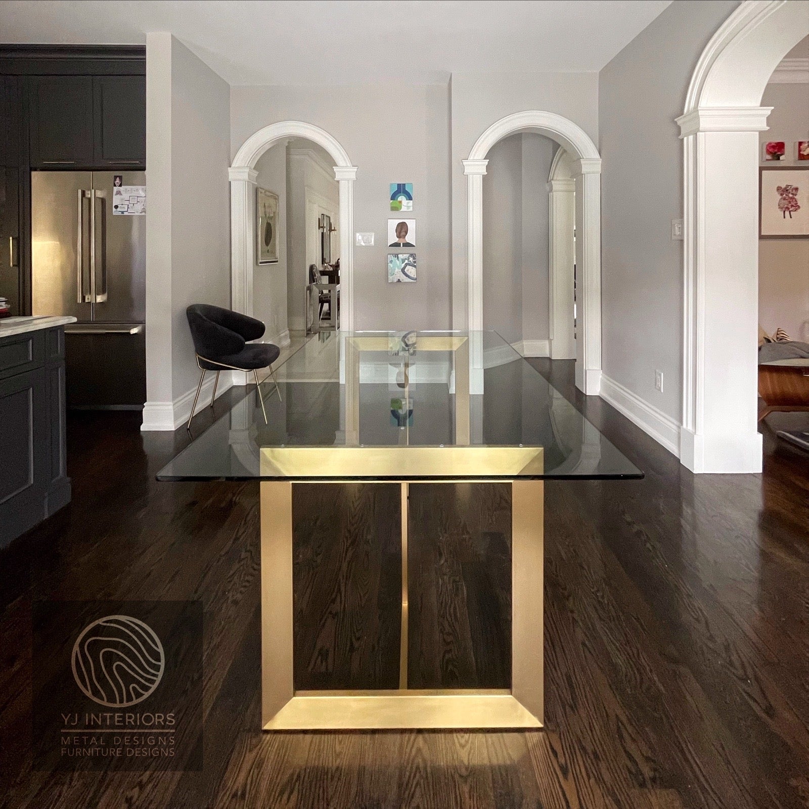 Modern trio table with clear tempered glass top and brass finish metal base.