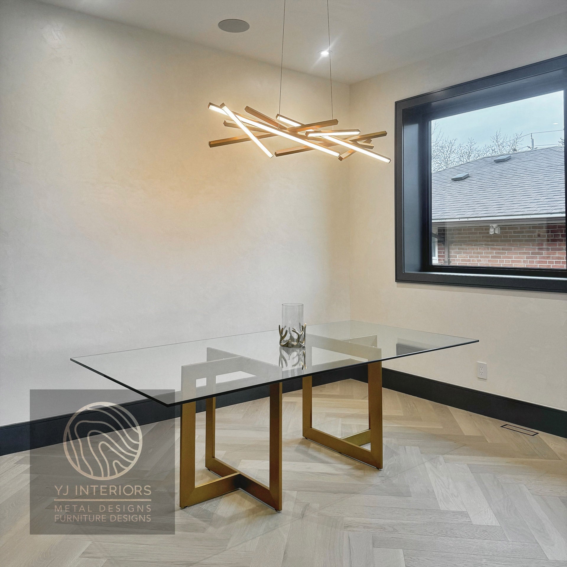 Modern trio table with clear tempered glass top and brass finish metal base.