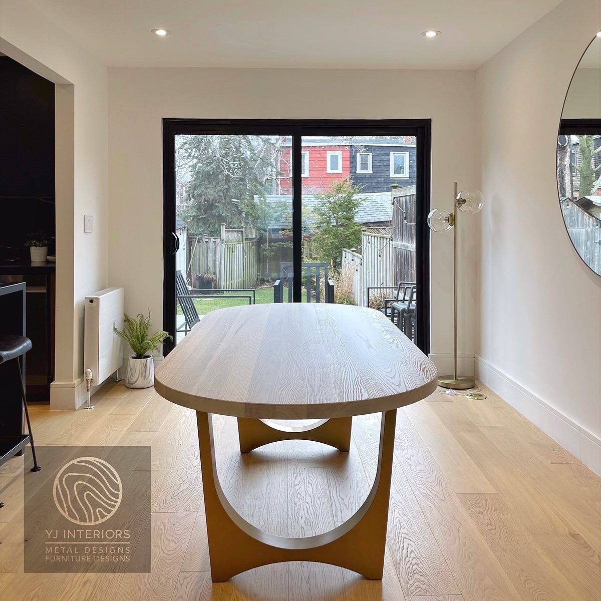 bleached oak oval brass table