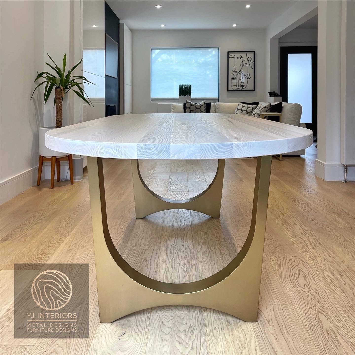 bleached oak oval brass table